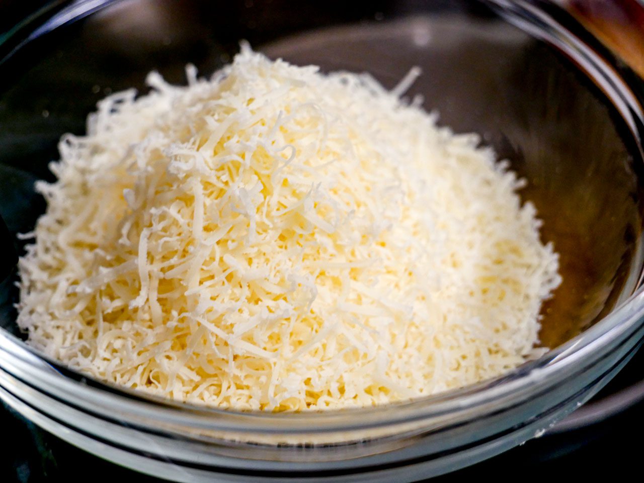 Grated parmesan in a clear bowl