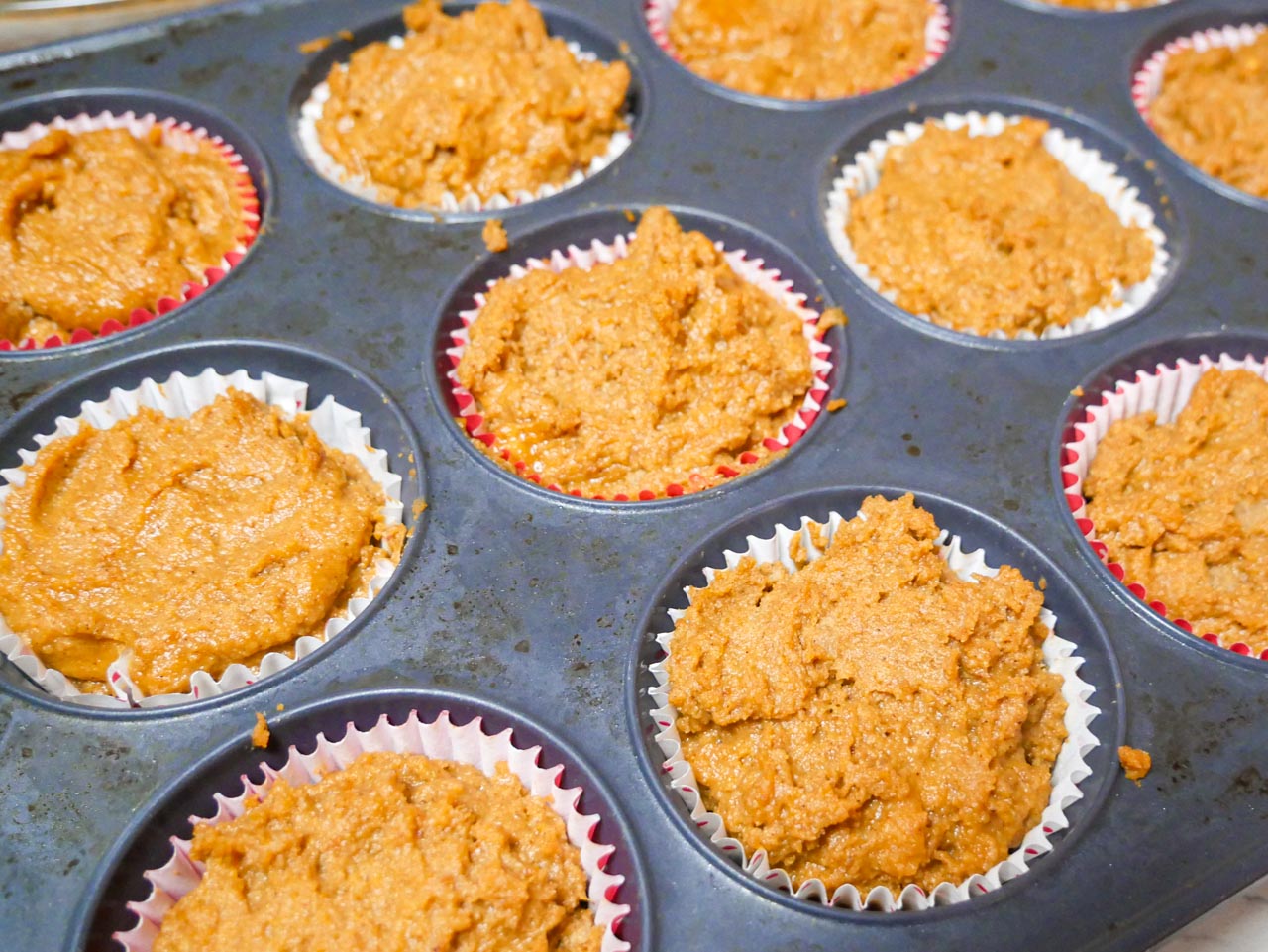 Pumpkin muffin batter in cupcake pan
