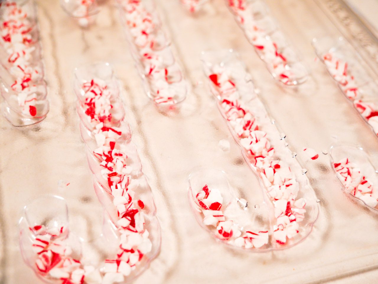 Crushed peppermint in candy cane mold