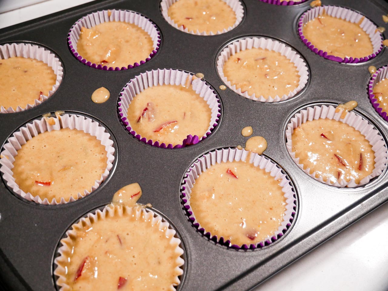 Plum muffin batter in cupcake liners